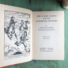 Load image into Gallery viewer, “The X Bar X Boys and the Sagebrush Mystery” by James Cody Ferris
