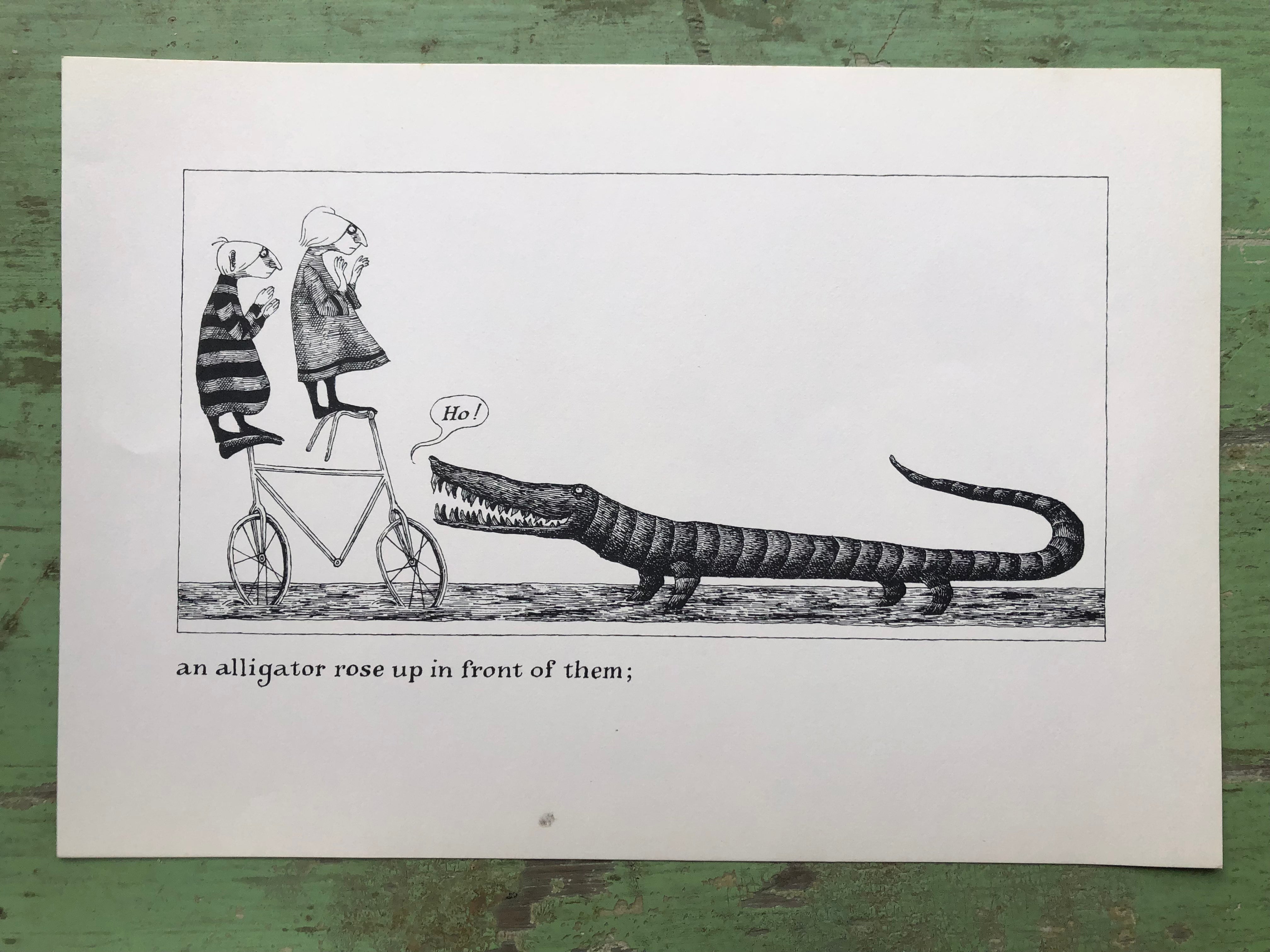 an alligator rose up in front of them;